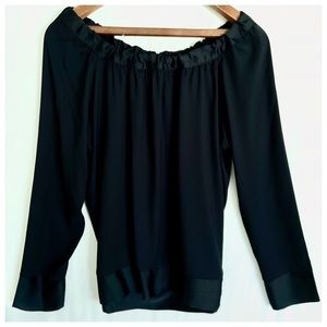 Elegant black top with satin trim